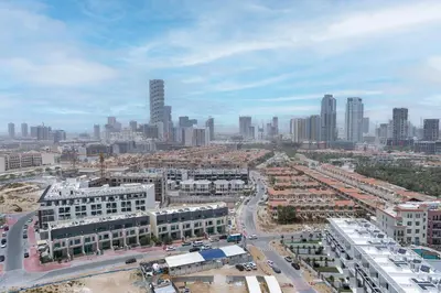 an aerial view of a city with tall buildings at Stylish 3 Bedroom in JVC in Dubai