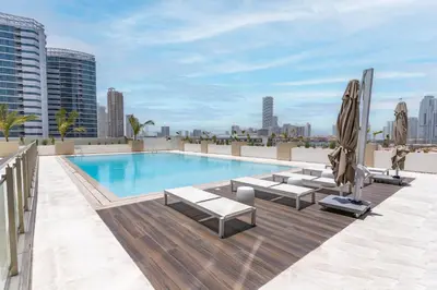 a swimming pool on the roof of a building at Stylish 3 Bedroom in JVC in Dubai