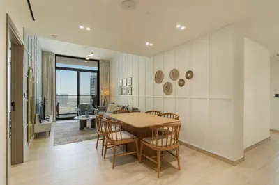 a dining room with a table and chairs at Stylish 3 Bedroom in JVC in Dubai
