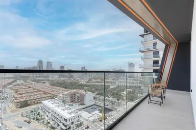 an apartment balcony with a view of a city at Stylish 3 Bedroom in JVC in Dubai