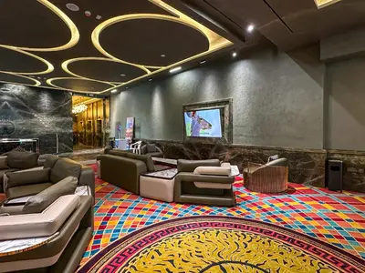 a lobby with couches and a television in a building at MBL Royal, JLT -One Bedroom with Lake View in Dubai