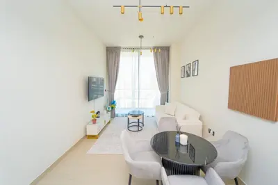 a living room with a table and a couch at AWS Holiday Homes - Perfect Dubai Stay! in Dubai