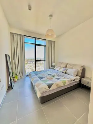 a bedroom with a bed and a large window at Creek edge,1 bedroom apartment, creek Harbour, high Floor in Dubai