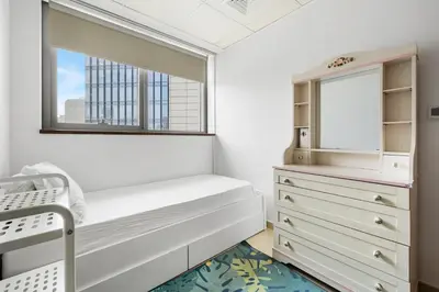 a bedroom with a bunk bed and a window at 3BR plus Maid Executive Tower L, City View in Dubai