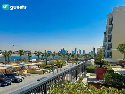 a view of a parking lot with a city at HiGuest - Coastal Luxury 2BR in La Mer Beachside Bliss in Dubai