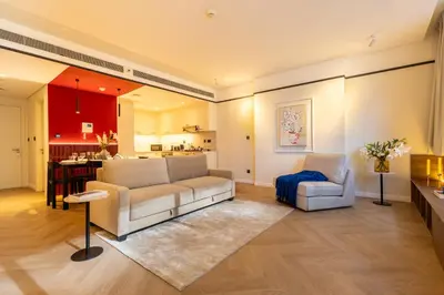 a living room with a couch and a chair at Stylish Luxury in the Heart of DIFC in Dubai