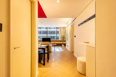 a hallway with a dining room and a living room at Stylish Luxury in the Heart of DIFC in Dubai