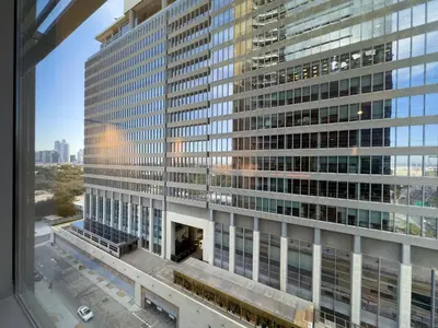 a view of a tall building from a window at Stylish Luxury in the Heart of DIFC in Dubai