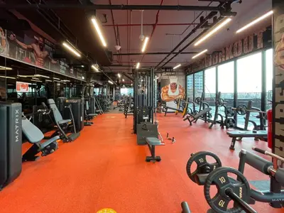 a gym with a lot of treadmills and machines at GuestReady - Stylish haven with lake views in Dubai