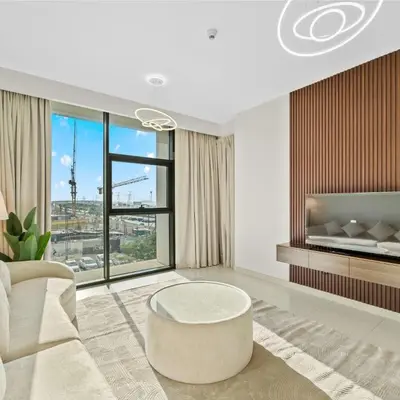 a living room with a couch and a table at Park Point C-1 bedroom for monthly stay-1004 in Dubai