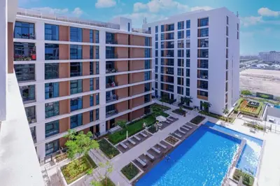 an aerial view of a building with a swimming pool at Park Point C-1 bedroom for monthly stay-1004 in Dubai
