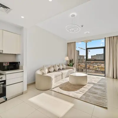 a white living room with a couch and a table at Park Point C-1 bedroom for monthly stay-1004 in Dubai