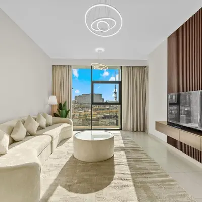 a living room with a couch and a large window at Park Point C-1 bedroom for monthly stay-1004 in Dubai