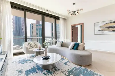 a living room with a couch and a table at Burj Vista Tower 2, Downtown - Upgarded 2 bedroom in Dubai