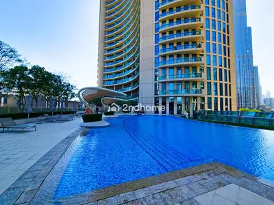 a swimming pool in a city with tall buildings at Burj Vista Tower 2, Downtown - Upgarded 2 bedroom in Dubai