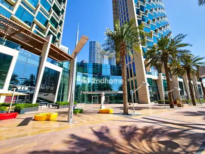 a city street with palm trees and a building at Burj Vista Tower 2, Downtown - Upgarded 2 bedroom in Dubai