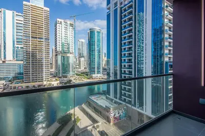 a view of a city from the balcony of a building at MBL Royal, JLT- 1-BR Apartment with Lake View in Dubai