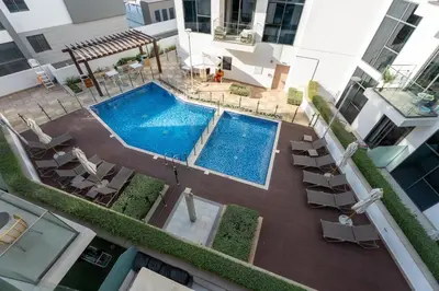 an overhead view of a swimming pool on a building at GuestReady - Contemporary retreat at Azizi Gardens in Dubai