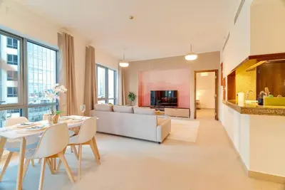 a living room with a table and a couch at Luxury Living Brand New 1 Bed Downtown Dubai Southridge in Dubai