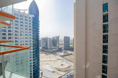 a view of a city from a tall building at Millenium Binghatti Residences Business Bay- Stylish Studio with Canal View in Dubai