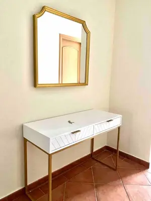 a white dressing table with a mirror on a wall at ONE Bedroom with Sea view in Dubai Marina - Z1106 in Dubai