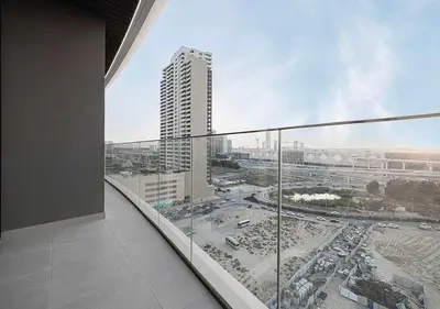 a view of a city from a balcony of a building at Chic 1-Bed Apartment with Exclusive Amenities JVC in Dubai