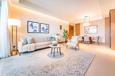 a living room with a couch and a table at Overlooking Burj Khalifa and Fountain Views from Living to Bedrooms, The Address Residences Dubai Opera Tower 2, Downtown Dubai by Deluxe Holiday Homes in Dubai