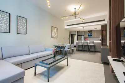 a living room with a couch and a table at MBL Royal, JLT- Two Bedroom with Lake View in Dubai