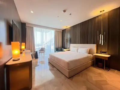 a hotel room with a bed and a desk at Daniels 4BR at Five Palm With Private Pool in Dubai