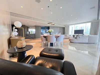 a living room with a table and chairs at Daniels 4BR at Five Palm With Private Pool in Dubai