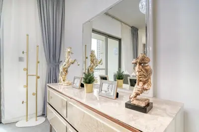 a dressing room with a large mirror and a dresser at THE JBR Grand Luxury Sea View 4 BEDROOM in Dubai