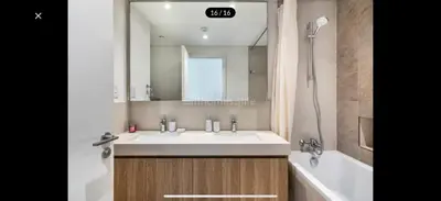 a bathroom with a sink and a bath tub and a sink at Downtown holiday home in Dubai