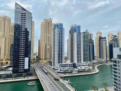 a view of a city with a river and buildings at Cozy Studio Dubai Marina by beach & Metro Z1503 in Dubai