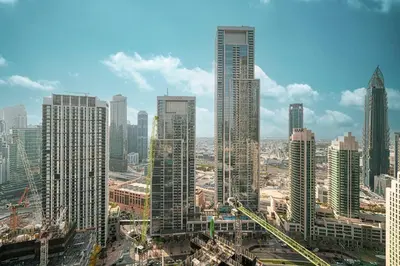 a group of tall buildings in a city at Sky High Luxury, Grande Signature, Burj Khalifa View, 5 minute walk to Dubai Mall in Dubai