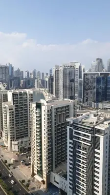 an aerial view of a city with tall buildings at Studio in downtown with Burj Khalifa and city view in Dubai