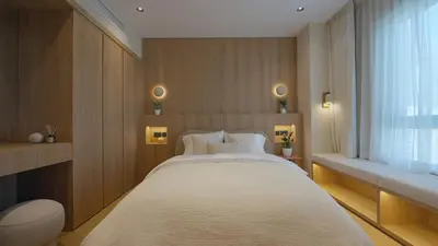 a bedroom with a large bed and a window at Mori - luxury Burj full view in Dubai