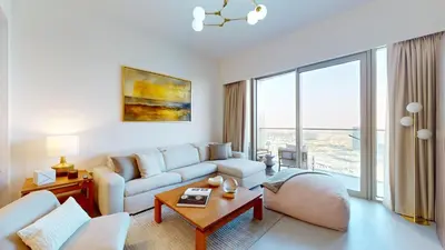 a living room with a couch and a table at Best 2 bedroom Direct Burj Khalifa Downtown View in Dubai