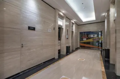 a hallway of a building with wooden walls at Cozy and elegant Studio in Business Bay in Dubai