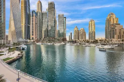 a view of a city with boats in the water at FIRST CLASS 1BR Inviting Marina Views in Dubai