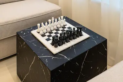 a chess board sitting on top of a table at Lux 5BR Marina Apt with Jacuzzi, Walk to Beach, Gym in Dubai
