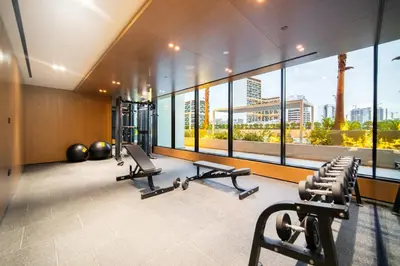 a gym with cardio equipment in a building at SettlerHomes - Serene JVC 1BR With Modern Luxury in Dubai