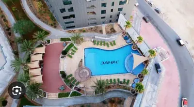 an overhead view of a pool at a resort at Capital bay in Dubai