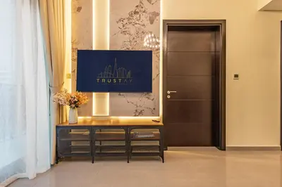 a dressing room with a mirror and a door at Stylish 1BR Business Bay - Near Metro - Balcony with City Views in Dubai