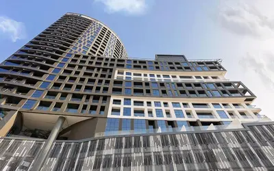 a tall building with a lot of windows at Lavish Studio at 15 Northside W City Skyline View 3rd floor in Dubai