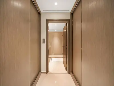 a corridor of a bathroom with a toilet at Ultra-Luxury 2 Bedroom Beachfront Escape with Sea Views in Dubai