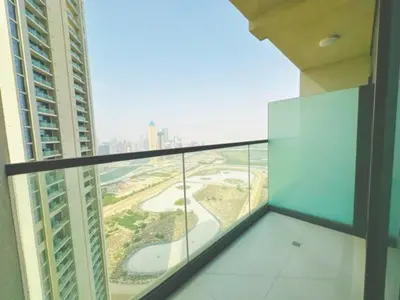 a balcony in a building with a view of a city at ايكون ستي 2BEd in Dubai