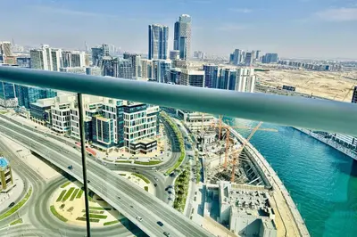 a view of a city with a highway and buildings at Vserve - Stylish specious - 1 Bedroom with Canal View in Dubai