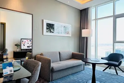 a living room with a couch and a table at Vserve - Stylish specious - 1 Bedroom with Canal View in Dubai