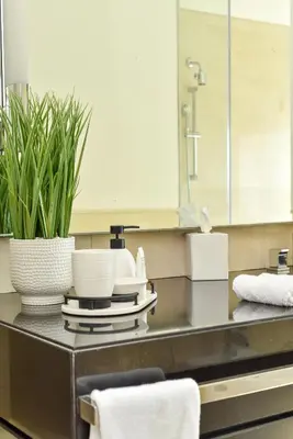 a bathroom counter with a sink and a mirror at Luxury Living At The Address Dubai Marina! in Dubai