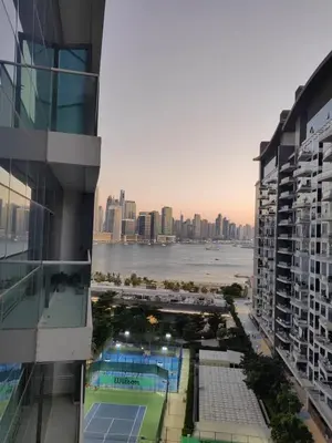 a view of a tennis court from a building at Seven Hotel Palm jumeirah in Dubai
